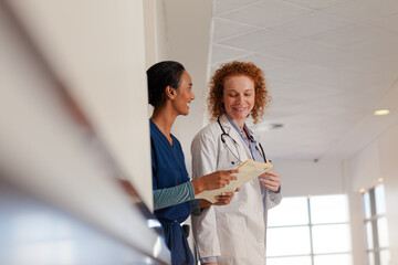 Doctor and nurse talking in hospital