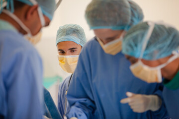 Fototapeta na wymiar Surgeons working in operating room
