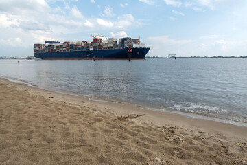 cargo container ship sailing on the river