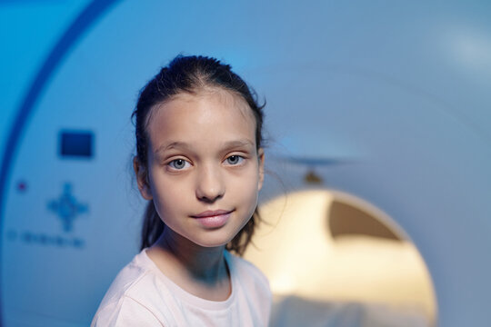 Face Of Cute Little Girl Looking At You In Medical Laboratory Before Or After MRI Scan Examination