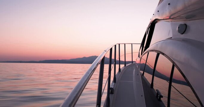 Point of view from luxury yacht sailing in the sea during sunset, luxury travel.