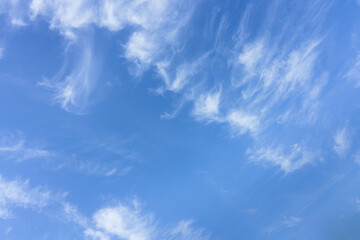 Naklejka na ściany i meble Blue sky with beautiful wispy clouds. background. Abstract sky background.