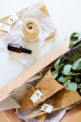 Mailbox with green eucalyptus leaves in. White background. Flat lay, top view. Flower Shop Concept.