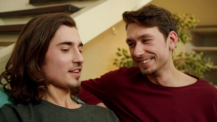 A lovely couple is sitting and talking nicely 