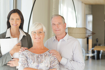 Financial advisor posing with clients