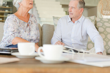 Couple relaxing on sofa together