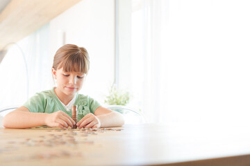 Girl stacking pennies on counter