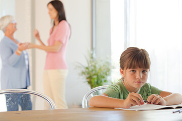 Girl doing homework at table