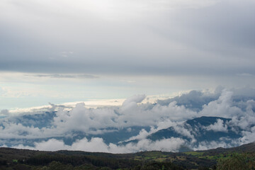 Cloudy horizontal landscape Colombian mountain range with clouds and mountains and sun Vía Nacional Letras