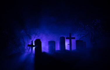 Scary view of zombies at cemetery dead tree, moon, church and spooky cloudy sky with fog, Horror...