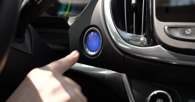 Pushing Power ON Ignition Button to Start Keyless Hybrid Car Electro Engine
