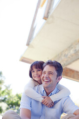 Father and daughter hugging outdoors