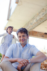 Father and daughter outdoors, smiling