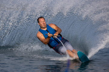 Slalom waterskier carving a turn.