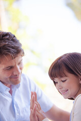 Father and daughter playing outdoors