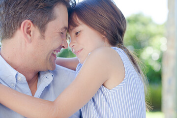 Fototapeta premium Father and daughter hugging outdoors