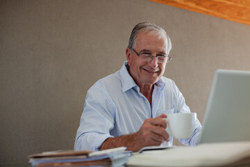 Older man working at desk