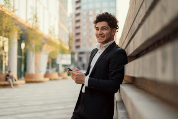 The lawyer makes online purchases in the store. A young entrepreneur manager communicates with a client in a messenger. He goes to work in the office.