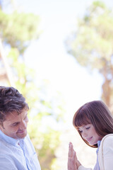 Father and daughter playing outdoors