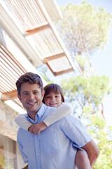 Father and daughter hugging outdoors