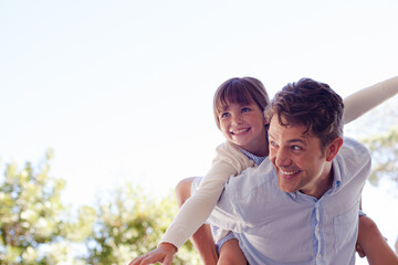 Father and daughter hugging outdoors