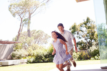 Fototapeta premium Father and daughter playing outdoors