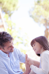 Father and daughter playing outdoors
