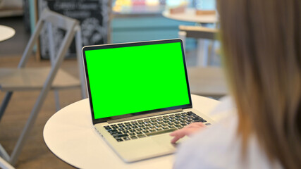 Woman Working on Laptop with Chroma Key Screen
