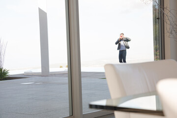 Businessman talking on cell phone outdoors