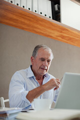 Older man working at desk