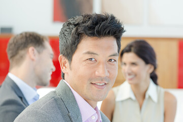 Businessman smiling in meeting