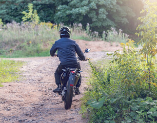 Man moves on the motorcycle.
