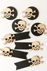 laser cut wooden scary monster faces, skull and bones, and ghosts on black chalk tags on white