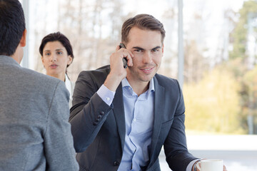 Businessman talking on cell phone