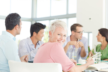 Fototapeta premium Businesswoman smiling in meeting