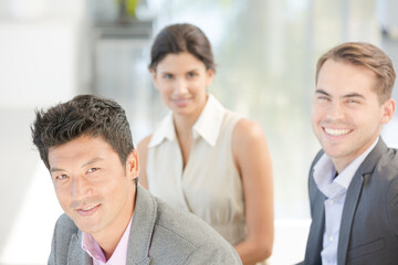 Business people smiling on sofa