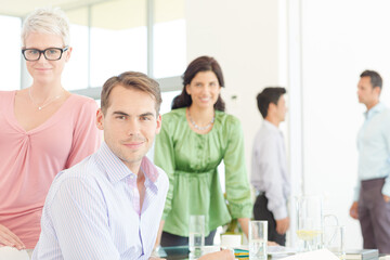 Business people smiling together in office