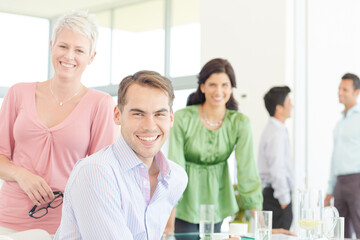 Business people smiling together in office
