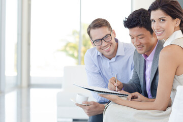 Business people smiling on sofa