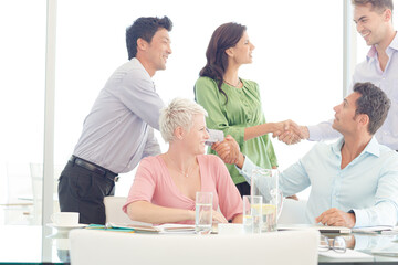 Fototapeta premium Business people shaking hands in meeting