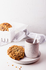 Oatmeal cookies on a ceramic set on a white surface