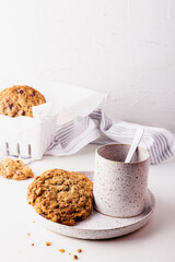 Oatmeal cookies on a ceramic set on a white surface