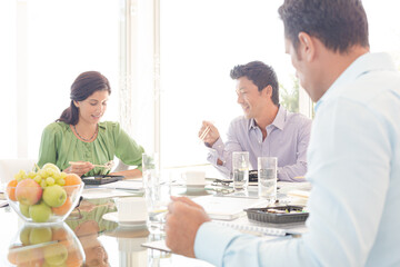 Business people smiling in lunch meeting