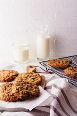 Homemade Oatmeal cookie on a wooden board and cooling rack