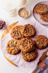 Homemade Oatmeal cookie on a wooden board and cooling rack