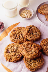 Homemade Oatmeal cookie on a wooden board and cooling rack