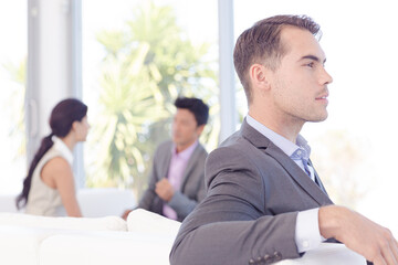 Businessmen smiling in office