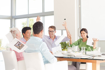 Business people cheering in meeting