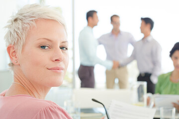 Businesswoman smiling in meeting