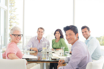 Business people smiling in meeting